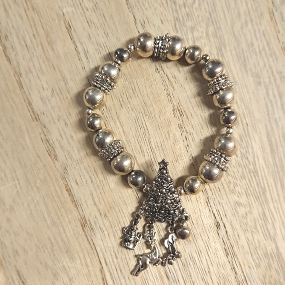 Silver tone stretchy seasonal holiday bracelet Christmas tree with dangle charms